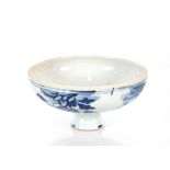 A Chinese blue and white pedestal bowl, having prunus decoration, 16cm dia. x 9cm high