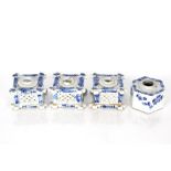 A collection of four late 19th Century Chinese blue and white porcelain inkwells, three square and