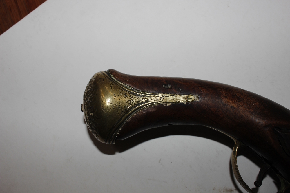 An 18th Century flintlock pistol, with brass mounts - Image 10 of 25