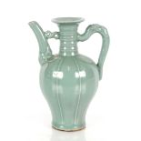 A Chinese celadon glazed water dropper, of baluster form with upswept spout and dragon handle,