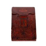 A 19th Century French red rock and leather tobacco pouch, decorated with smoking motifs verso with a