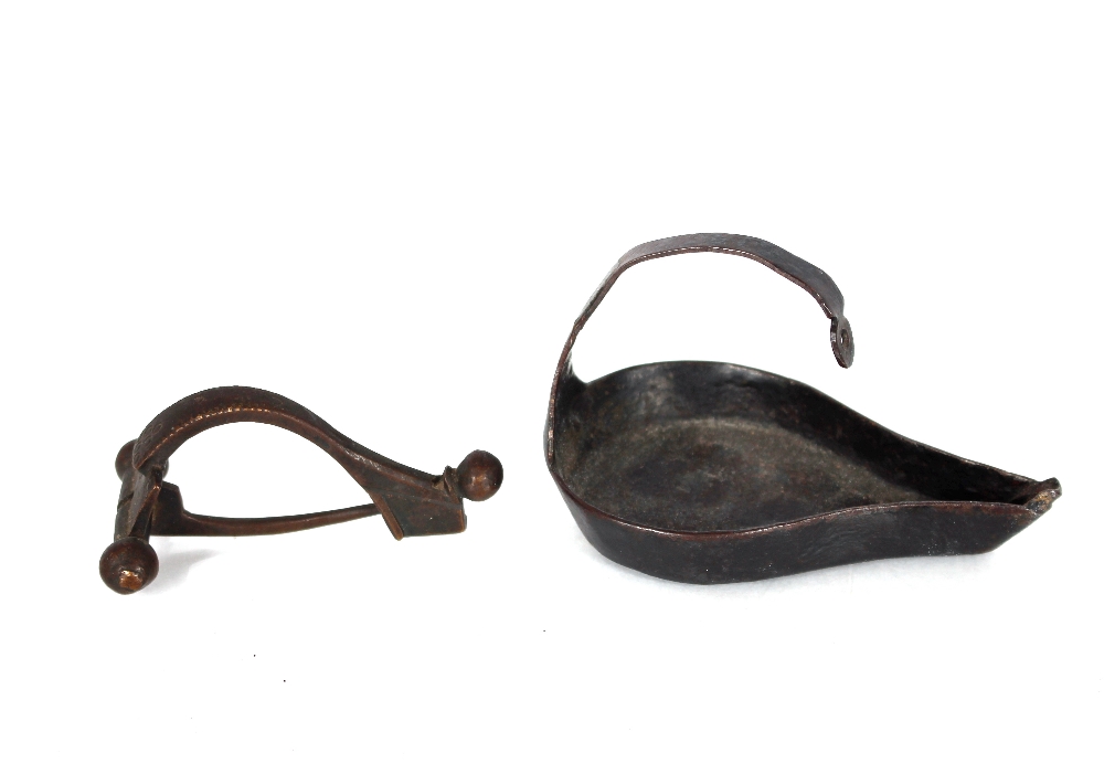 A small bronze Roman type toga pin; and a hanging oil lamp (2)