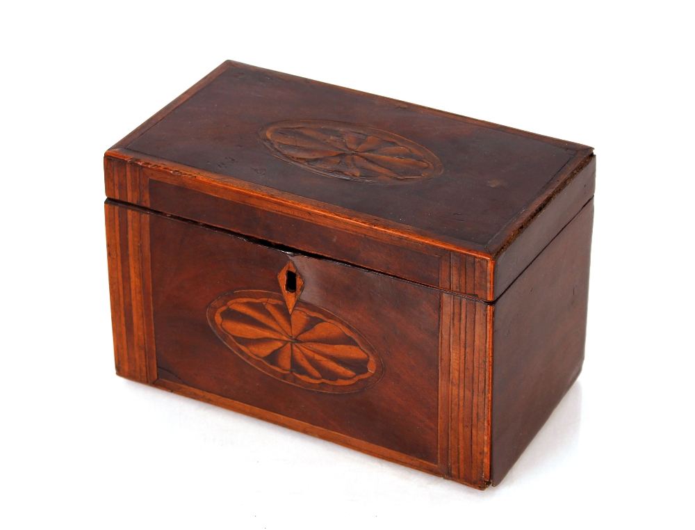 A Georgian mahogany and cross banded tea caddy, with shell inlaid decoration