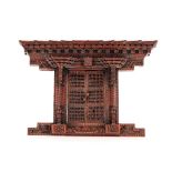 A late 19th Century Chinese carved wooden architectural frame, the pagoda type edge and twin opening