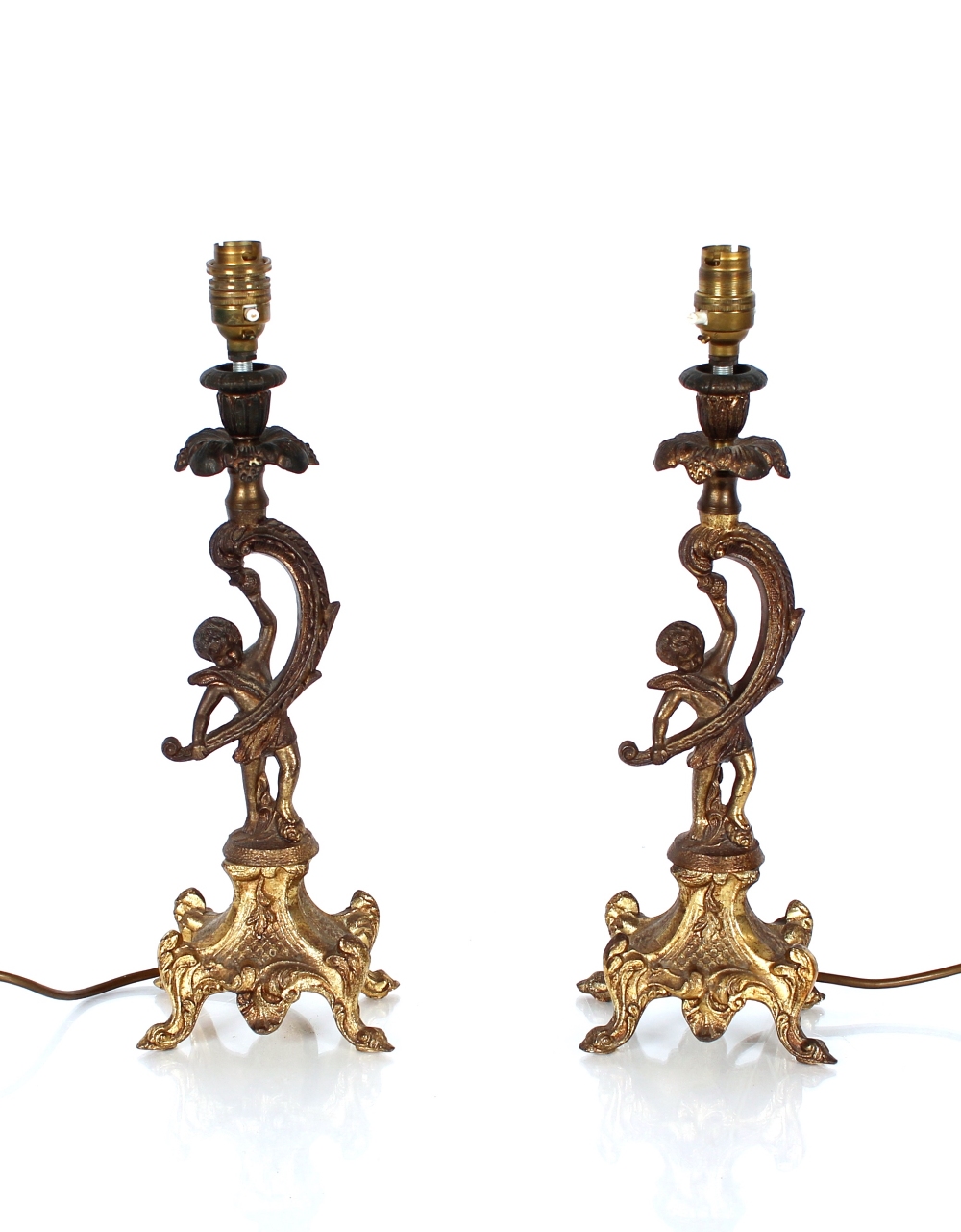 Two spelter figures of cherubs, in the Rococo manner holding aloft candle sconces converted to