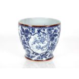 A Royal Bonn blue and white pottery planter, having all over floral decoration, 28.5cm dia. x 25cm