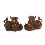 A pair of Chinese bronze models of Kylin, on plinth bases 12cm high