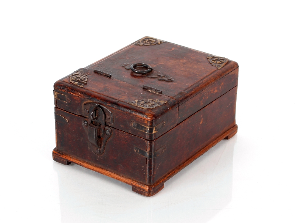 A Chinese wooden and metal bound dressing table box, the hinged lid opening to reveal a hinged
