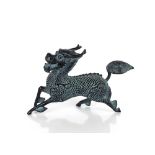 A Chinese bronze model of a Xiezhi galloping, 15cm long, mark to tail