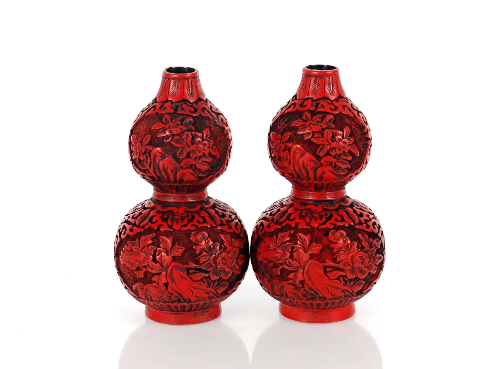 A pair of cinnabar lacquered style double gourd shaped vases, bearing gilt four character marks