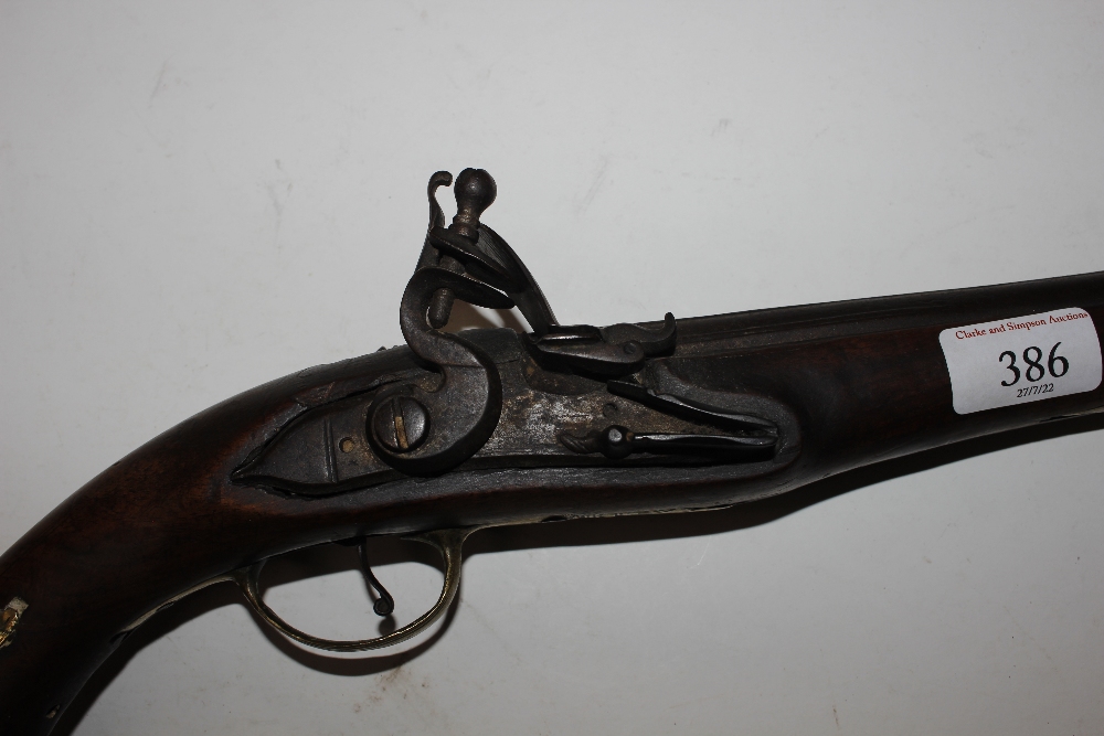 An 18th Century flintlock pistol, with brass mounts - Image 12 of 25