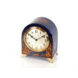An early 20th Century blue lacquer and chinoiserie decorated desk clock, of arched form by
