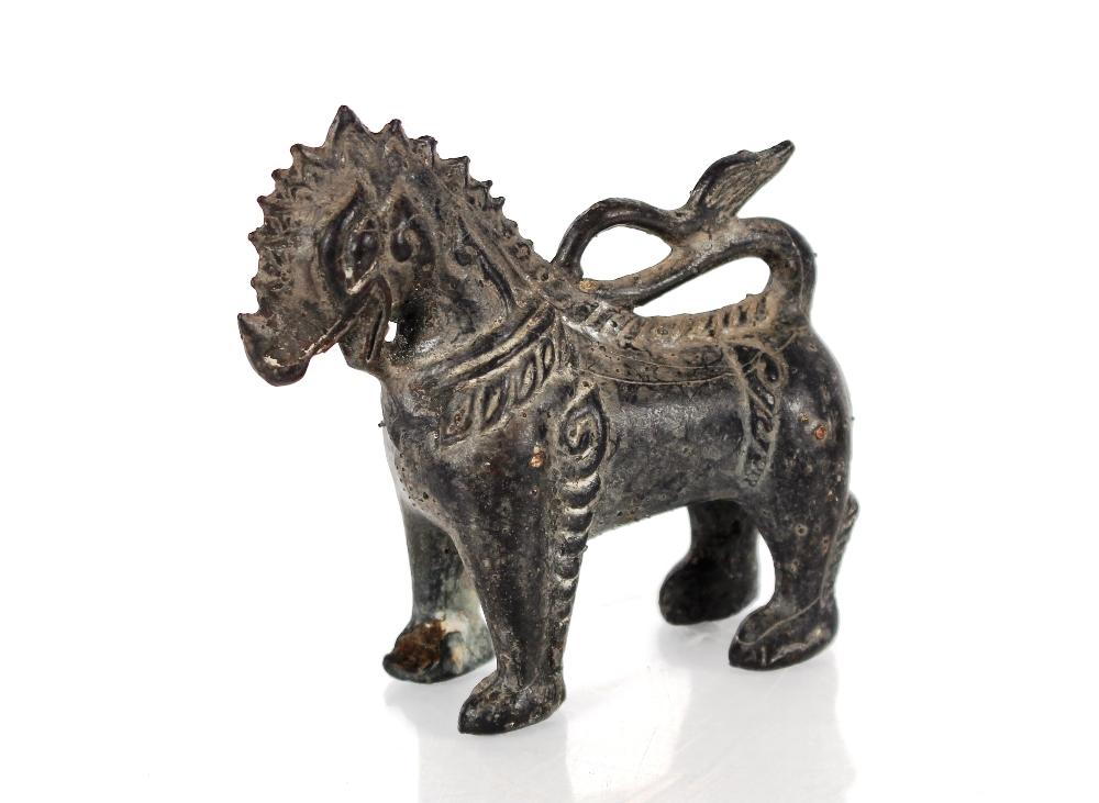 A Chinese bronze model of a Kylin, 19cm high