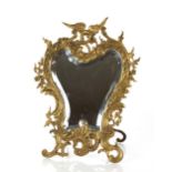 An ornate vintage small brass mirror, 44cm high