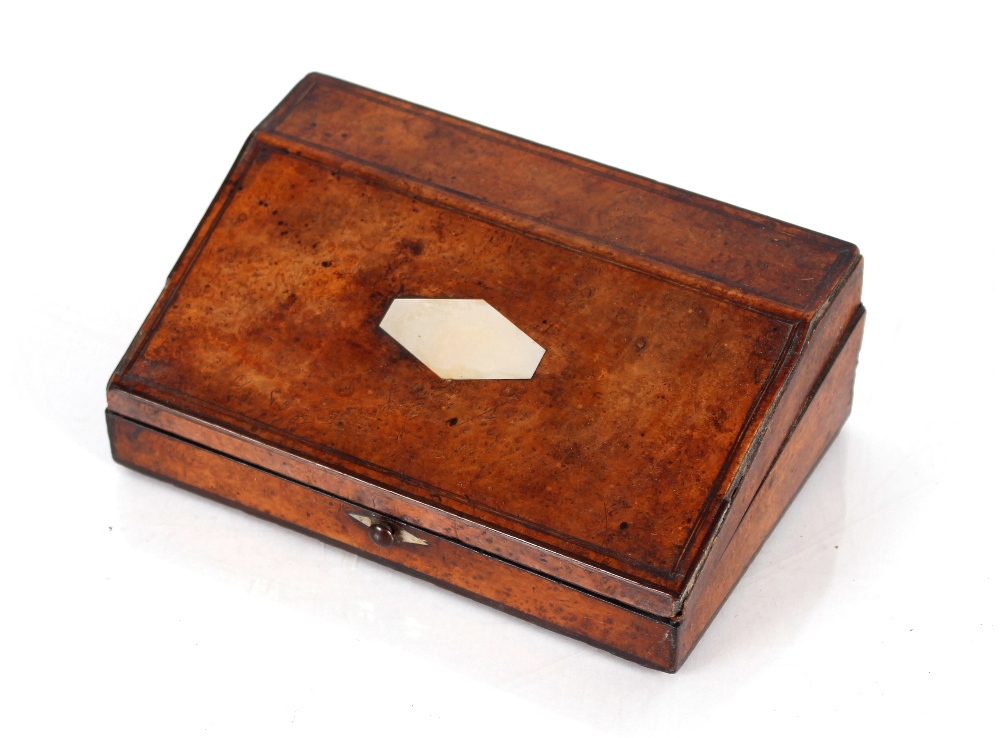 A 19th Century walnut and mother of pearl inlaid necessaire, having sloping hinged lid with some