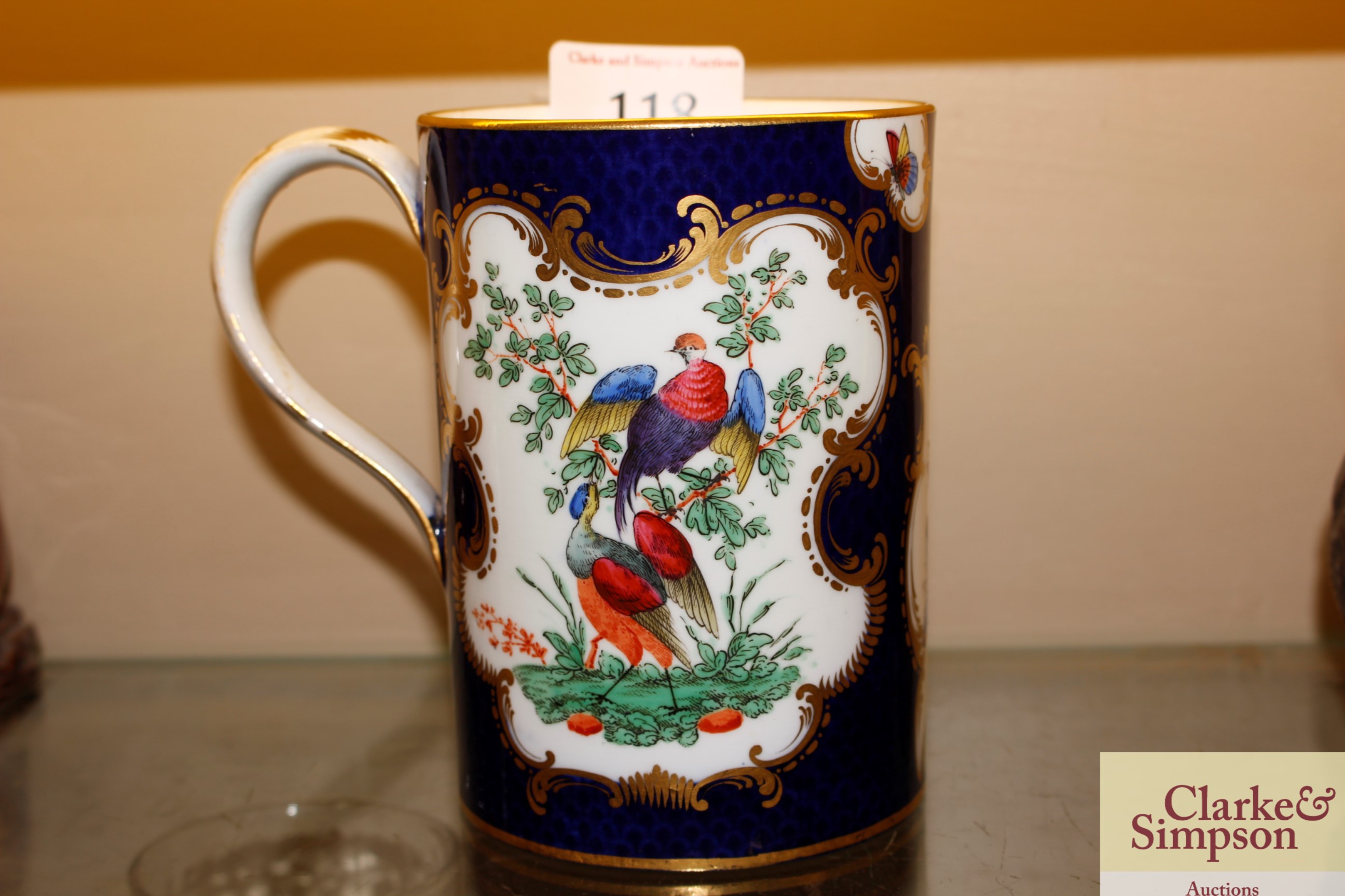 A Worcester style mug, having painted panel decora