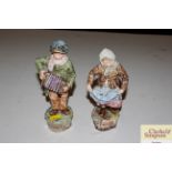 A pair of Continental pottery figures depicting st