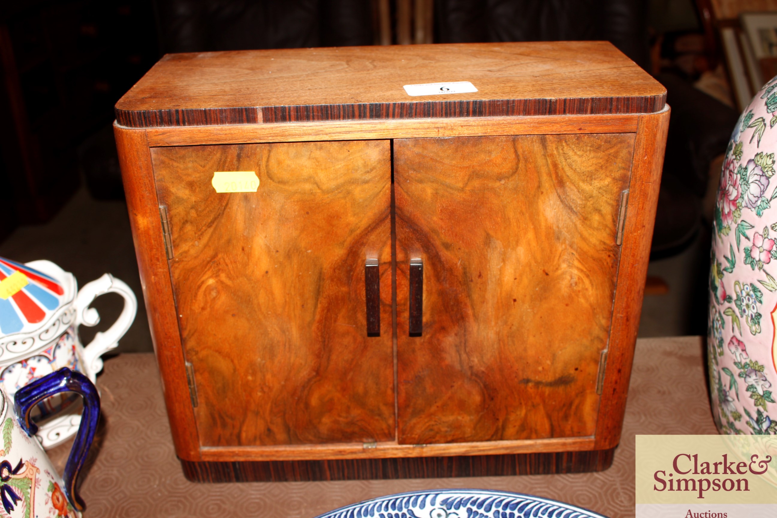 A walnut Art Deco miniature cabinet