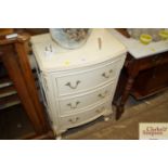 A cream and gilt Louis style three drawer chest