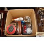 A box of miscellaneous coinage, tins, and commemor
