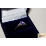 A 925 ring set amethyst coloured stone