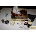 A box containing purses, place mats, decanter labe