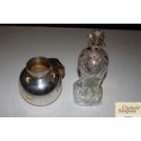 A 19th Century hour glass shaped decanter with sil