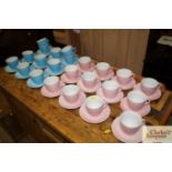 A collection of Tams pink and blue tea cups and sa