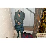 A vintage Boy Mannequin dressed in Scottish costum