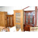 An antique pine display cabinet