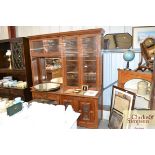 An early 20th Century oak combination bookcase, ha