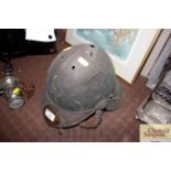 An antique brass military helmet