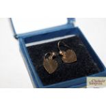 A pair of yellow metal heart ear-rings