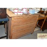 A light oak chest of three drawers