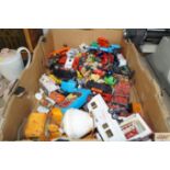 A box of various die-cast vehicles and other toys