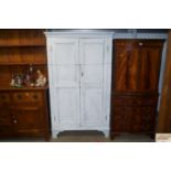 A white painted pine cupboard