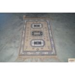 An approx. 4'3" x 2'3" patterned rug