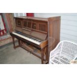 A Rogers of London mahogany cased upright piano