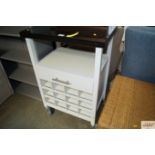 A granite topped kitchen trolley