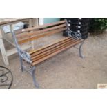 A wooden and cast iron garden bench