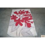 An approx. 5' x 3'4" modern patterned rug