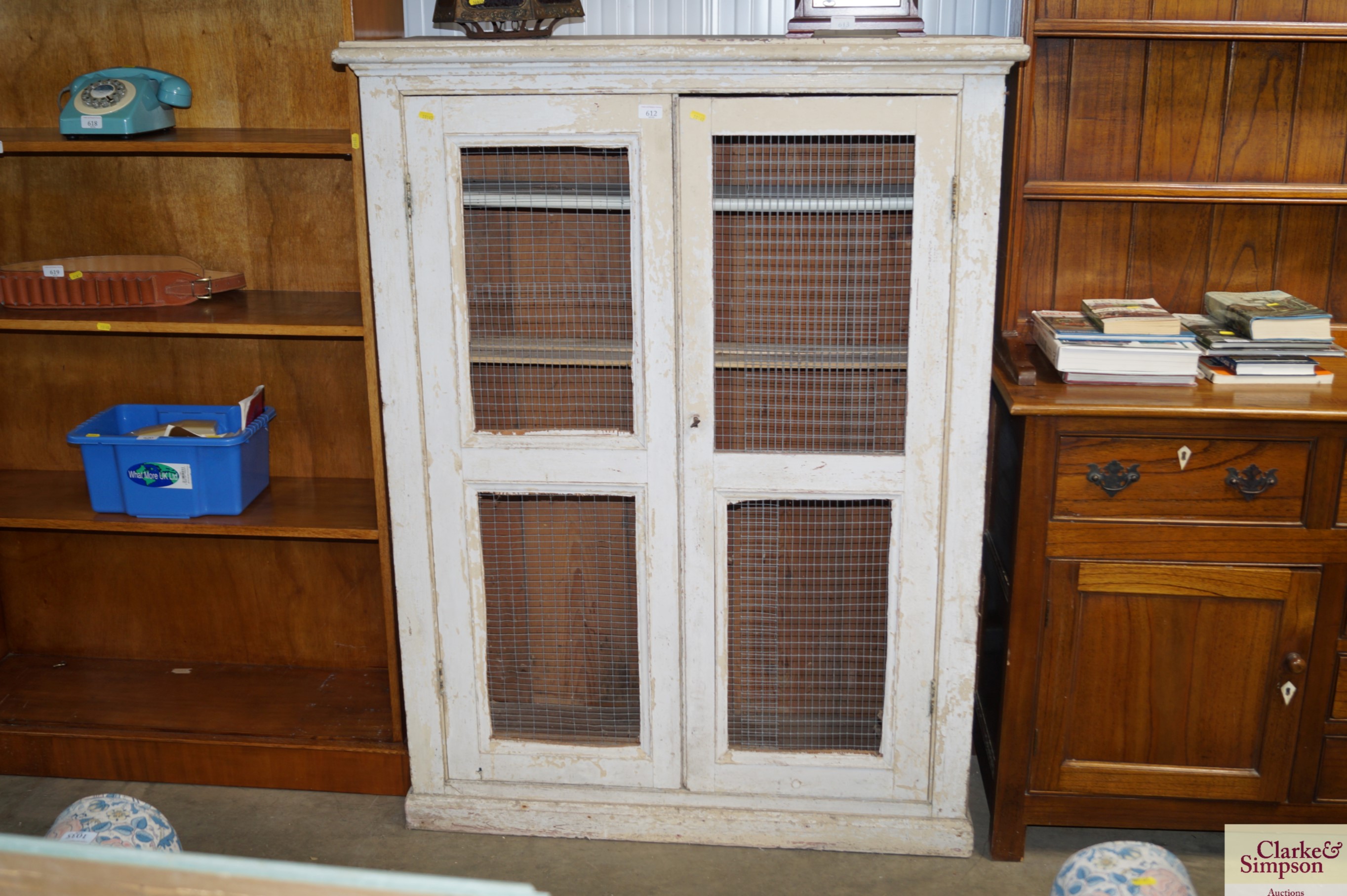 A painted pine cupboard with mesh doors