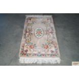 An approx. 4' x 2'4" Chinese style patterned rug
