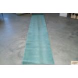 An approx. 11'6" x 2'4" patterned runner