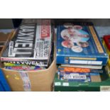 Two boxes of various games and puzzles