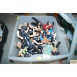 A box containing mostly wrestling action figures