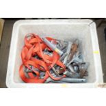 A box of spring clips and straps