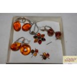 Four pairs of amber and Sterling silver ear-rings;