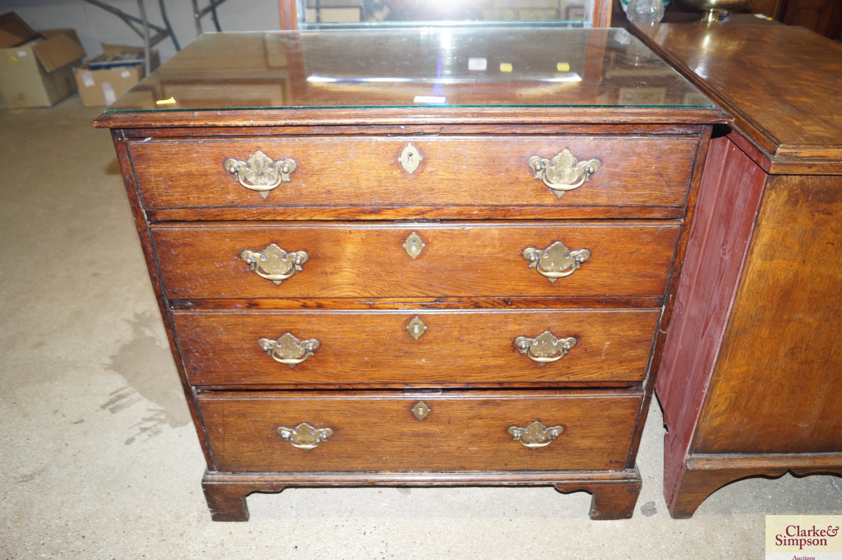 An 18th Century oak chest fitted four graduated dr
