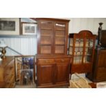 A Victorian walnut bookcase on cupboard